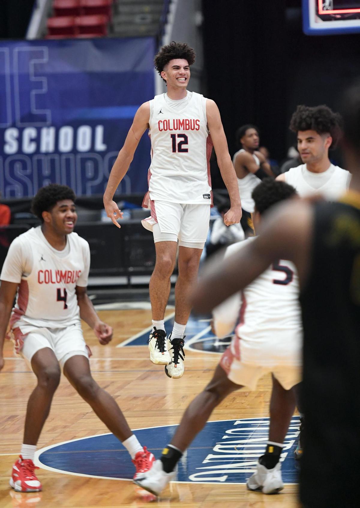 Columbus’ Cameron Boozer (12) jumps up in celebration with his teammates after beating Oak Ridge in the Class 7A final during the Florida High School State Championships at the RP Funding Center in Lakeland, Fl on Saturday March 9, 2024. Columbus defeated Oak Ridge 72-67 in overtime. Scott Wheeler | Photo