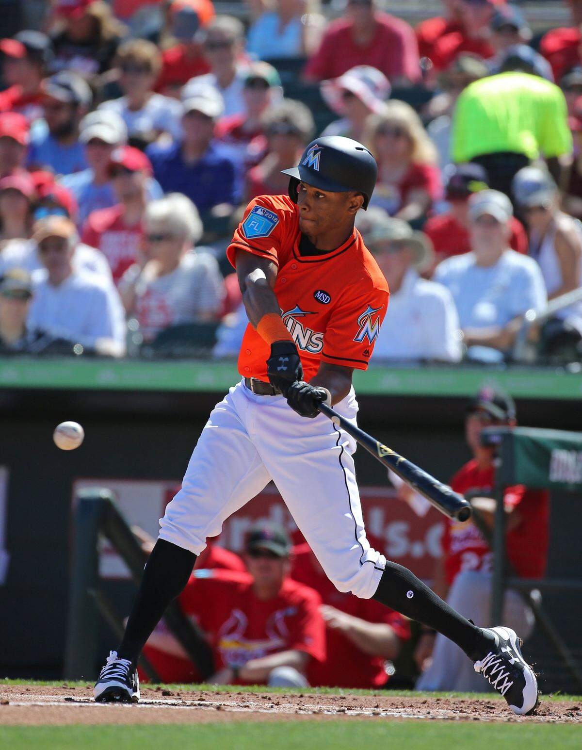 Miami Marlins right fielder Magneuris Sierra bats during the first inning of a spring training baseball game against St. Louis Cardinals at Roger Dean Chevrolet Stadium on Friday, February 23, 2018 in Jupiter. Marlins honoring Stoneman Douglas shooting victims with special hats, T-shirts, patches.