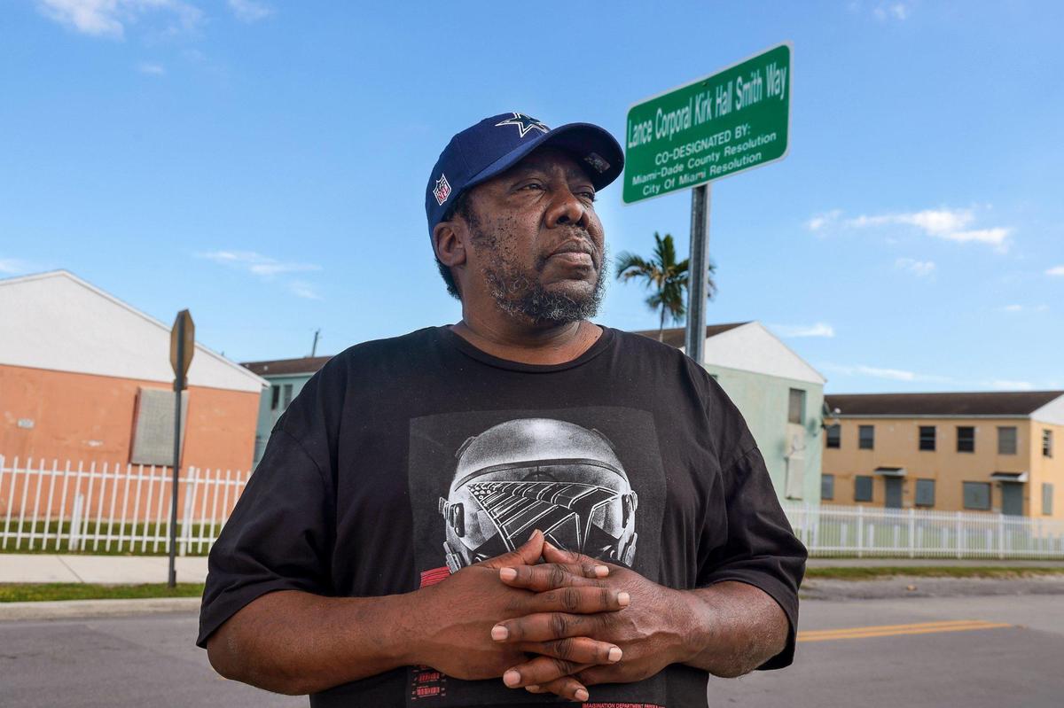 Terrence “Uncle Tee” Smith stands by the sign named after his brother. A street in the heart of Liberty Square is named after his brother Lance Corporal Kirk Hall Smith who lost his life in the 1983 U.S. Embassy bombing in Beirut. Liberty Square, or the Pork n’ Beans as locals call it, was where the Smith brothers were raised in Miami, Florida.