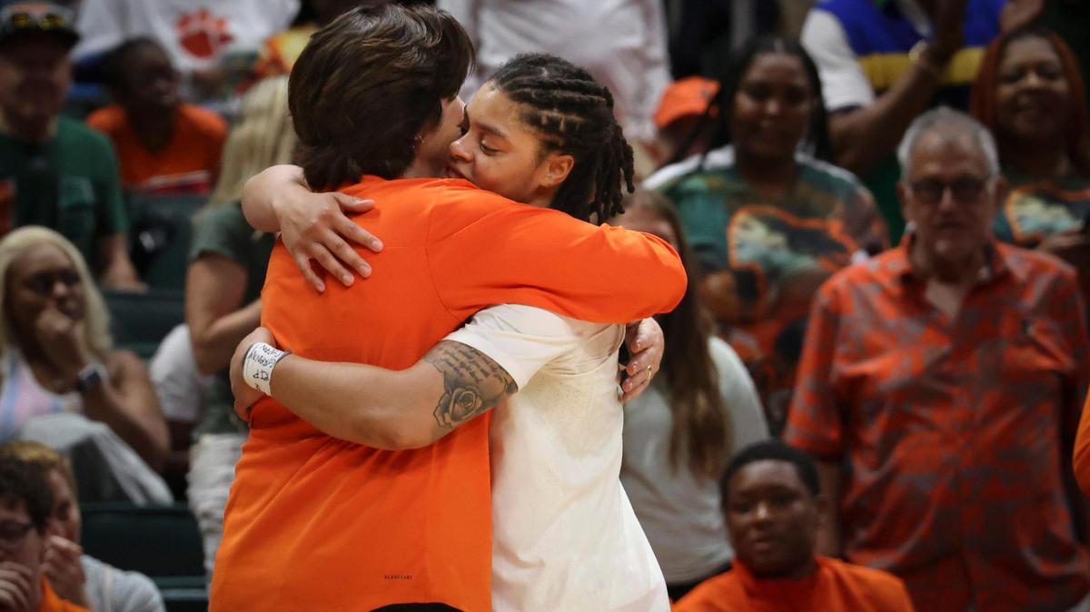 Hurricane’s Heach Coach Katie Meier hugs player Destiny Harden (3) as she steps off the court in the last home game during the fourth quarter of a NCAA women’s basketball game between the University Miami Hurricanes and the University of Virginia on Sunday, Feb. 26, 2023, at the Watsco Center in Coral Gables.