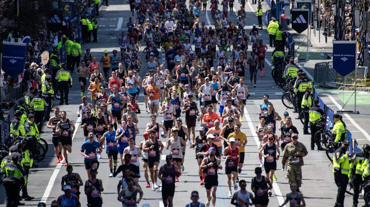 Runners make their way down Boylston Street as they compete in the 129th Boston Marathon on April 21, 2025, in Boston, Massachusetts.