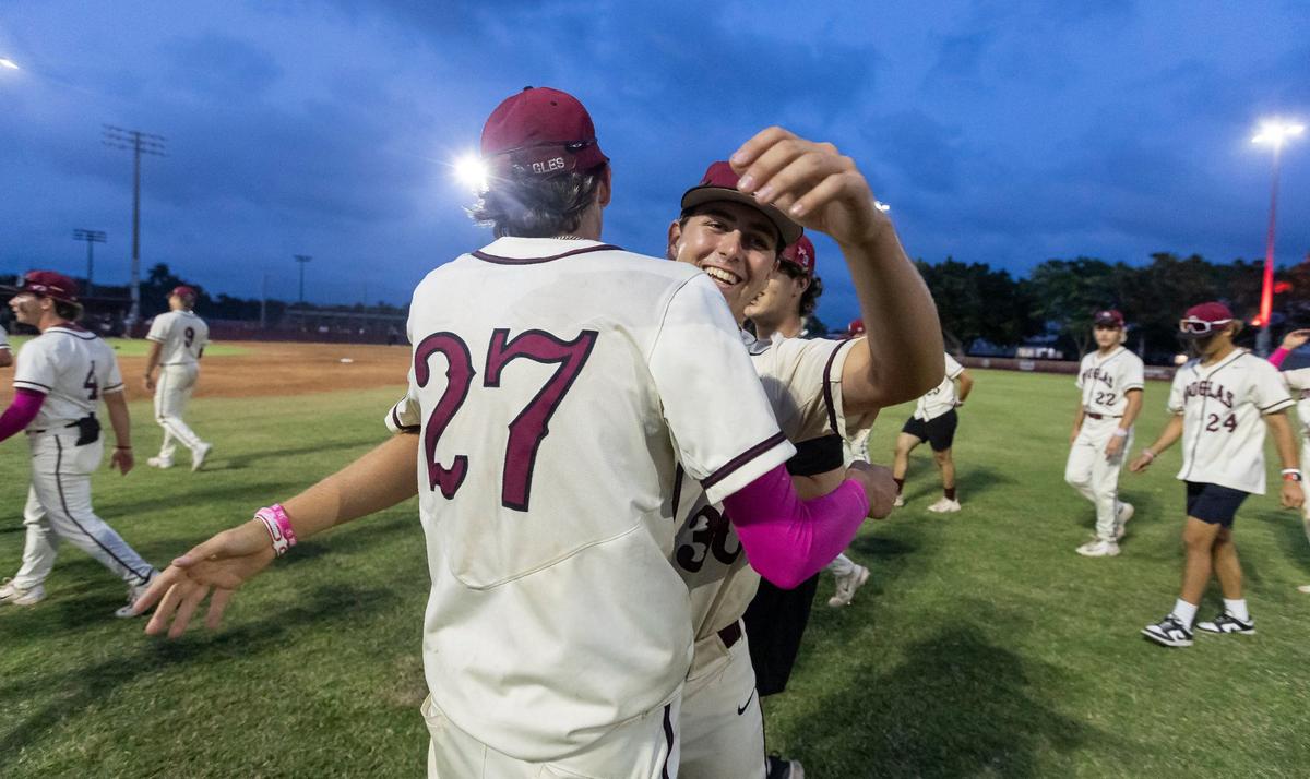 Marjory Stoneman Douglas Eagles’ pitcher Jayden Dubanewicz (27) hugs Breylynn Courtney (30) after they defeated the West Broward Bobcats during their Region 4-7A baseball final at Anthony Rizzo Field on Monday, May 13, 2024, in Parkland, Fla.