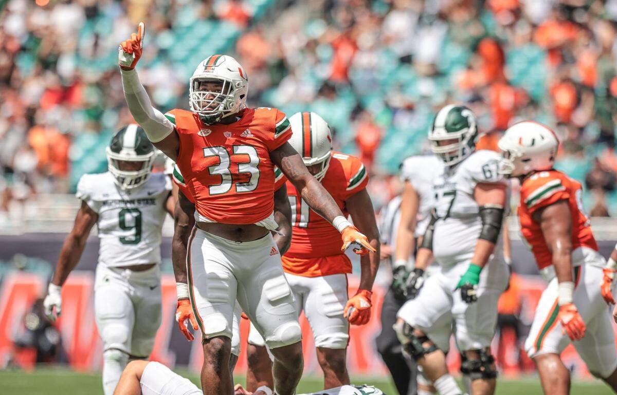 Miami Hurricanes defensive lineman Chantz Williams (33) reacts after sacking Michigan State Spartans quarterback Payton Thorne (10) in the first quarter at Hard Rock Stadium in Miami Gardens on Saturday, September 18, 2021.