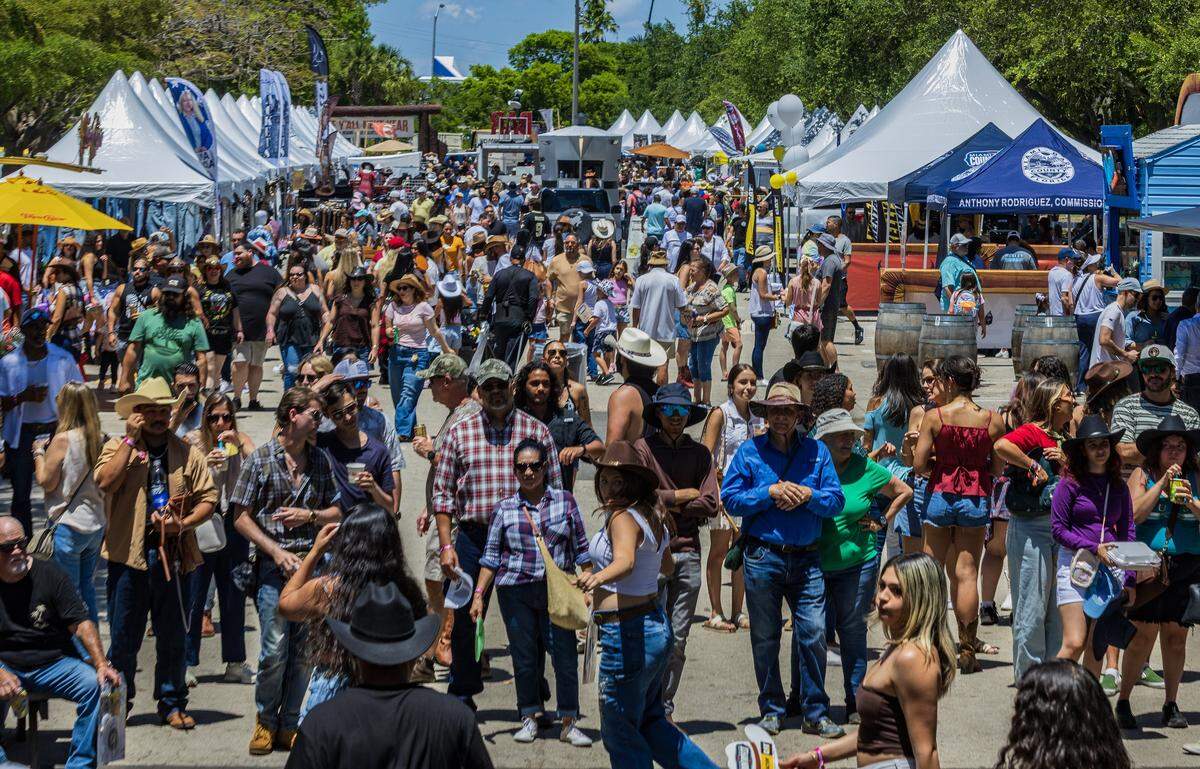 Fairgoers enjoy the weather during the Miami-Dade CountryFest 2026, at Tropical Park, an annual festival free of charge event that offers a weekend of entertainment for all ages, in Miami on Saturday, April 25, 2026.