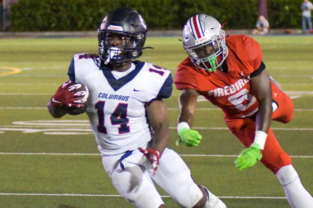 Miami Columbus running back Sedrick Irvin runs down the field in a game against Doral Academy on Friday, Oct. 14, 2022, at Doral Academy.