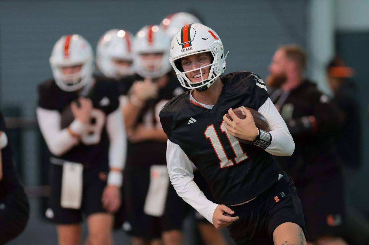 Miami Hurricanes quarterback Carson Beck (11) works out during spring practice at the Carol Soffer Indoor Practice Facility at the University of Miami in Coral Gables, Florida, Monday, March 3, 2025.