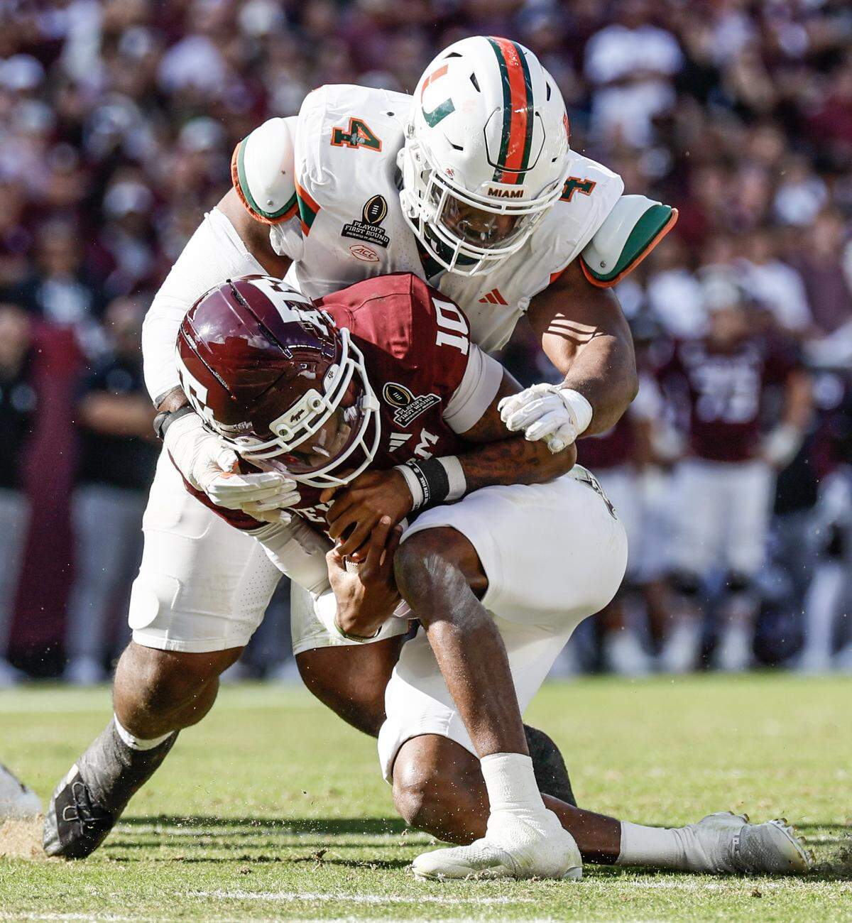 Miami Hurricanes defensive lineman Rueben Bain Jr. (4) sacks Texas A&M Aggies quarterback Marcel Reed (10) in the second half of the first round of the 2025 College Football Playoff at Kyle Field at College Station, Texas, on Saturday, December 20, 2025.