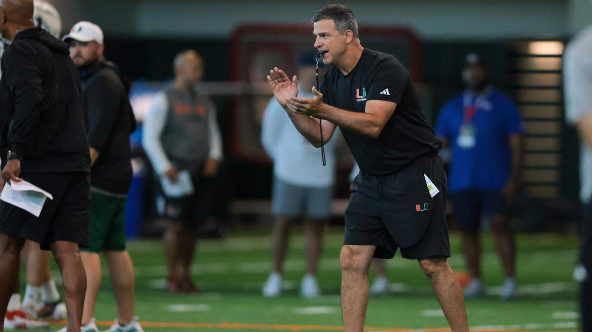 Miami Hurricanes head coach Mario Cristobal reacts during football practice at the Carol Soffer Indoor Practice Facility at the University of Miami in Coral Gables, Florida, on Thursday, Aug. 7, 2025.