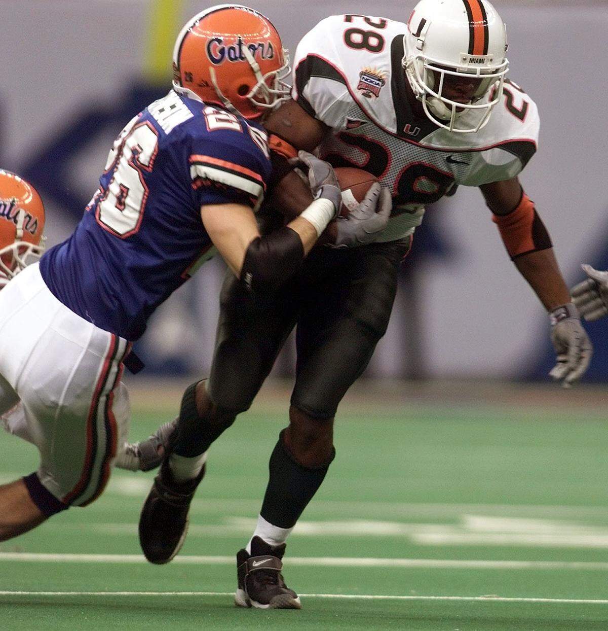 In 2001, Clinton Portis of UM is brought down by Todd Johnson of UM in the third quarter of the Sugar Bowl in New Orleans.