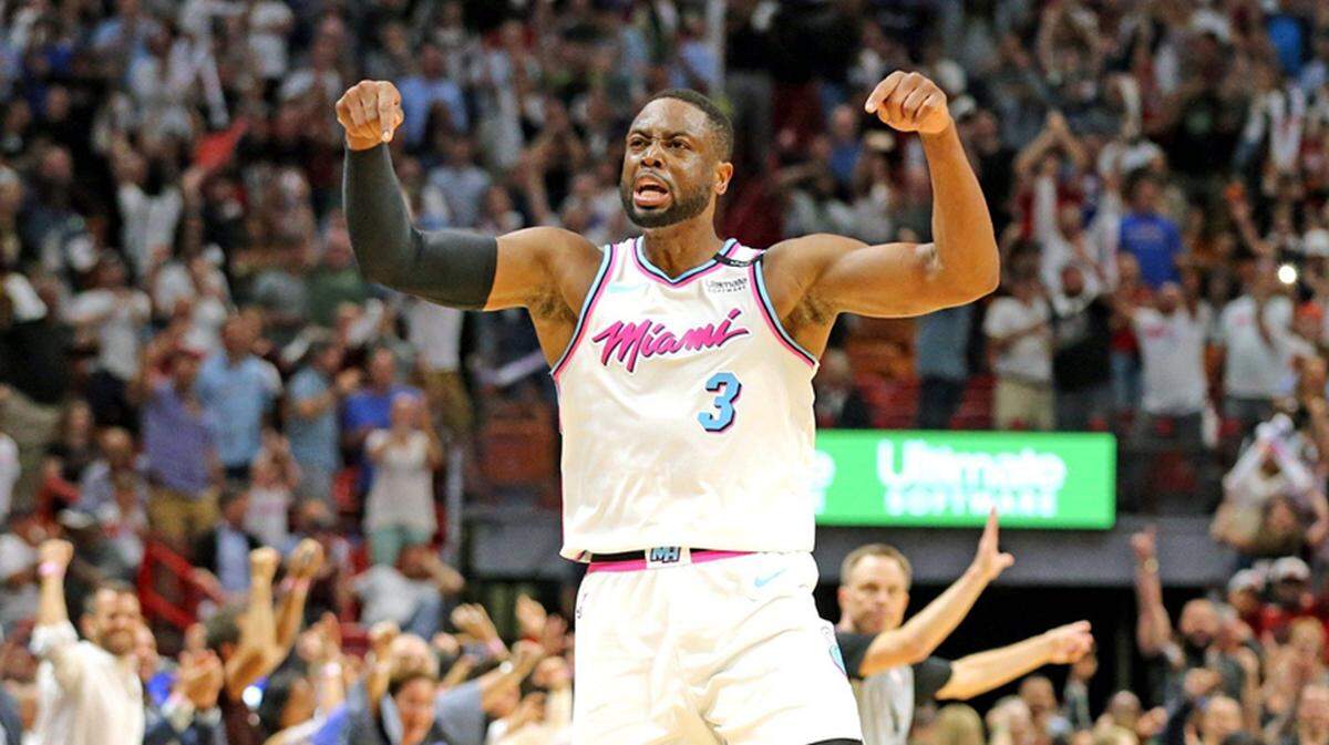 Miami Heat Dwyane Wade screams with the crowd after scoring the winning basket to defeat the Philadelphia 76ers in the final seconds of the game at the AmericanAirlines Arena in Miami, Florida, February 27, 2018.