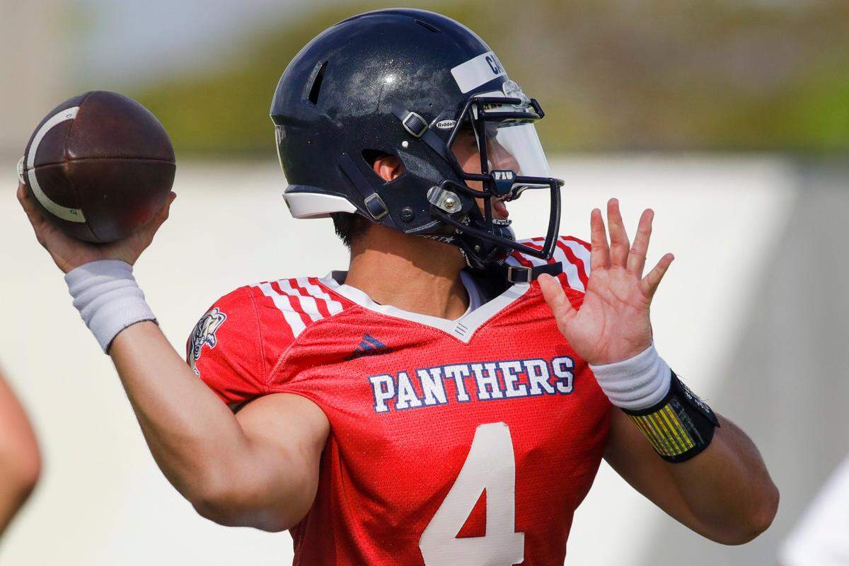 Florida International University quarterback Haden Carlson (4) throws the football during practice at the practice fields at Florida International University in Miami, Florida, on Thursday, March 24, 2022.