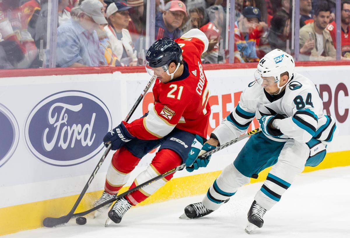 Florida Panthers center Nick Cousins (21) and San Jose Sharks defenseman Jan Rutta (84) compete for the puck in the second period of their NHL game at the Amerant Bank Arena on Tuesday, Oct. 24, 2023, in Sunrise, Fla.