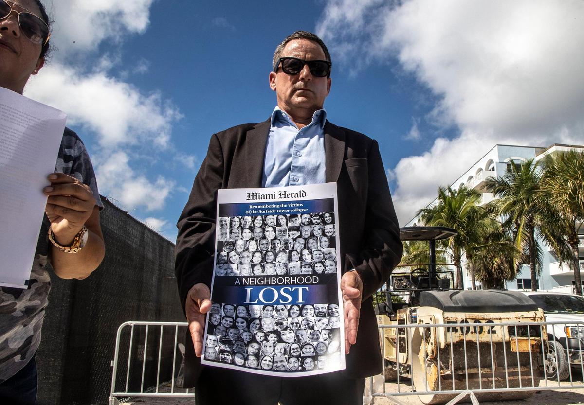 Pablo Langesfeld held a Miami Herald front page as he joined his family at the Champlain Towers South condo site, urging the county not to dispose of rubble that might still contain the remains of his daughter Nicole.
