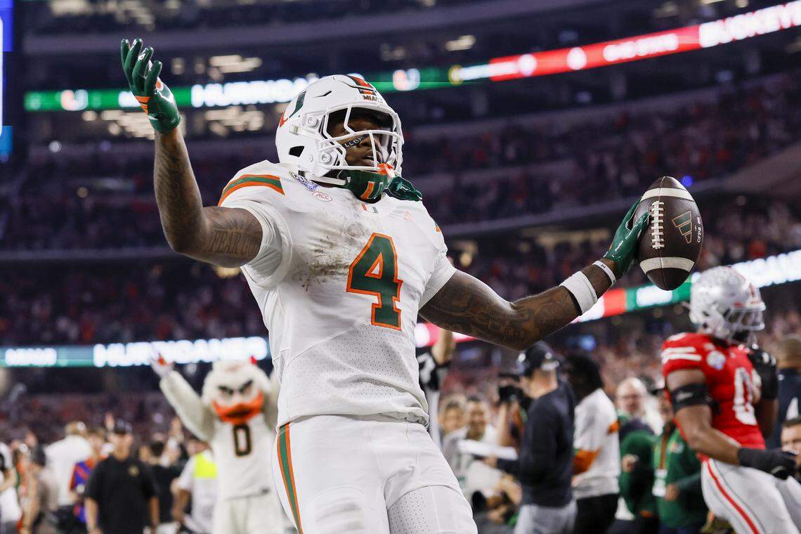 Miami Hurricanes running back Mark Fletcher Jr. (4) scores during the first half of the College Football Playoff quarterfinal game against the Ohio State Buckeyes in the Cotton Bowl at AT&T Stadium in Arlington, Texas on Wednesday, December 31, 2025.