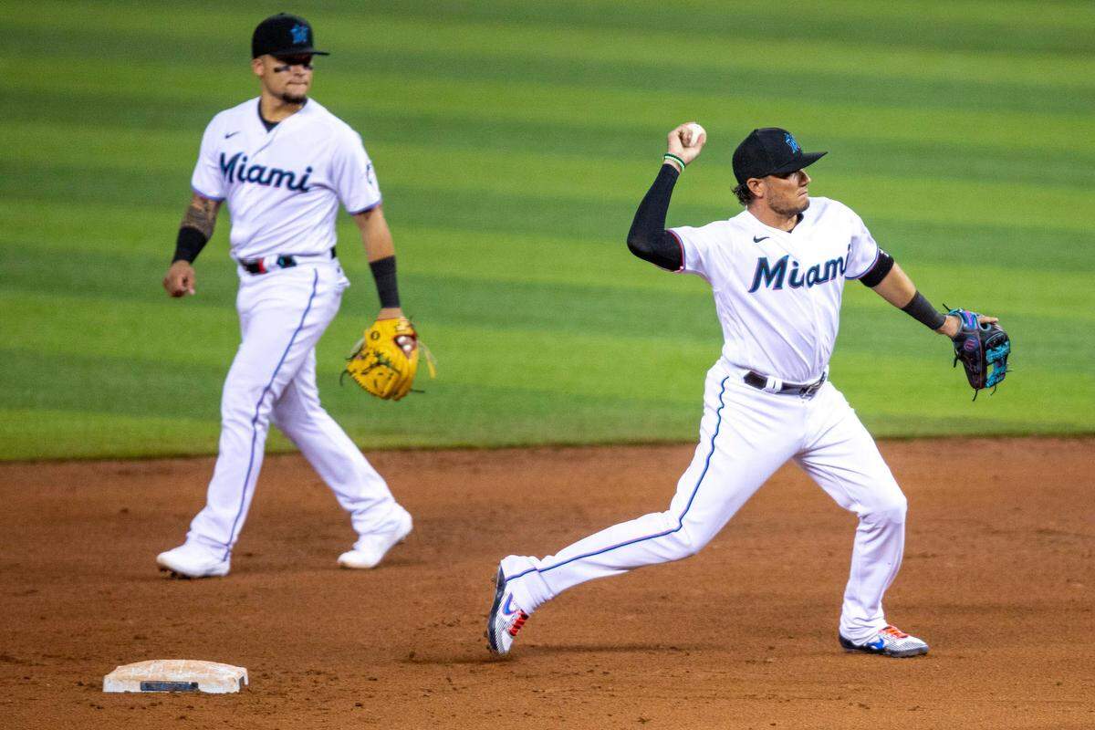 Marlins infielder Miguel Rojas throws to first base during a simulation game at Marlins Park in Miami, Florida on Friday, July 10, 2020.