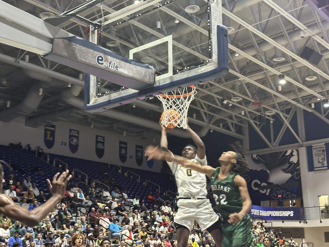 St. Thomas Aquinas’ Nate Accius (0) goes up for a rebound during Saturday’s Class 6A state boys’ basketball championship at UNF Arena in Jacksonville, Fla.