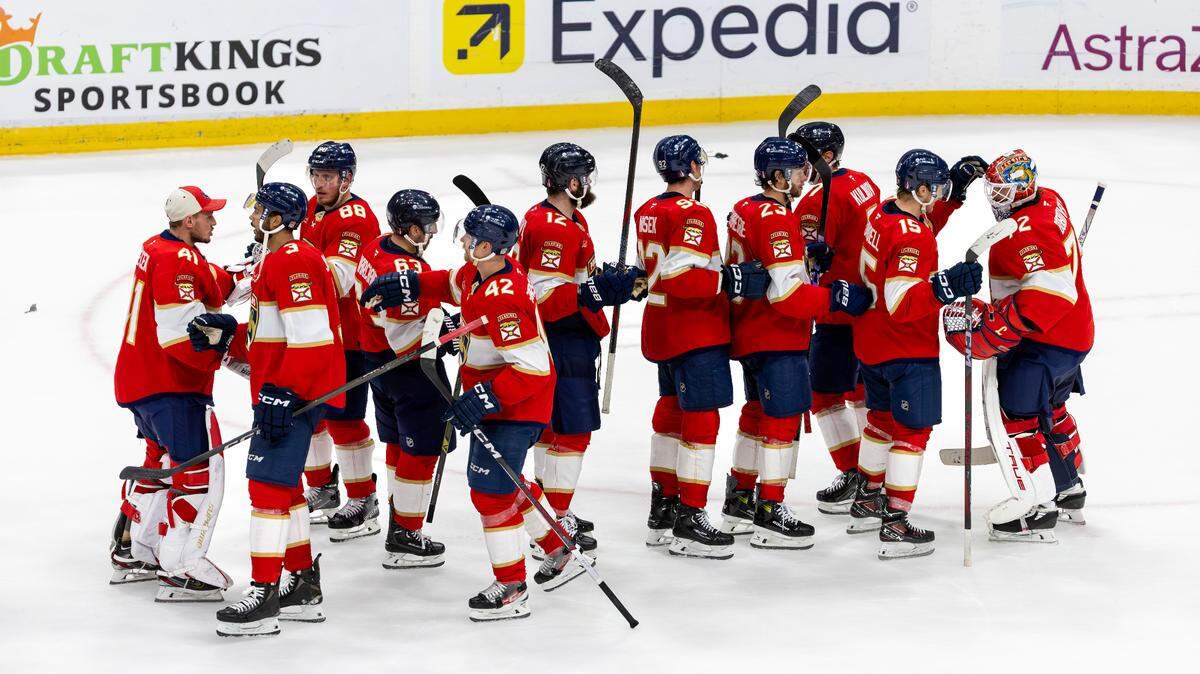 Florida Panthers players celebrate their 6-2 victory over the Carolina Hurricanes in Game 3 of the Eastern Conference Final during the NHL Stanley Cup Playoffs at Amerant Bank Arena on Saturday, May 24, 2025, in Sunrise, Fla.