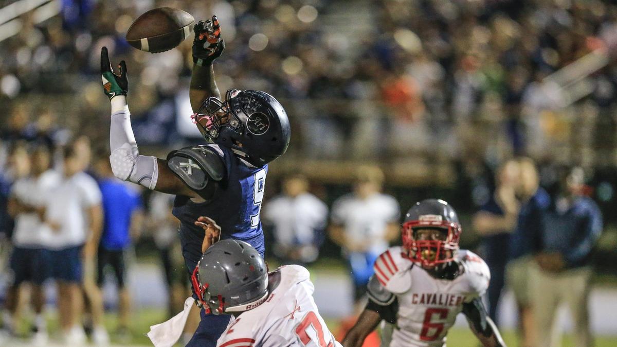 Columbus High’s tight end Gary Cooper (9) scores on a pass reception in the first quarter as Columbus faces Coral Gables at Tropical Park in a high school football playoff game on Friday, November 9, 2018.