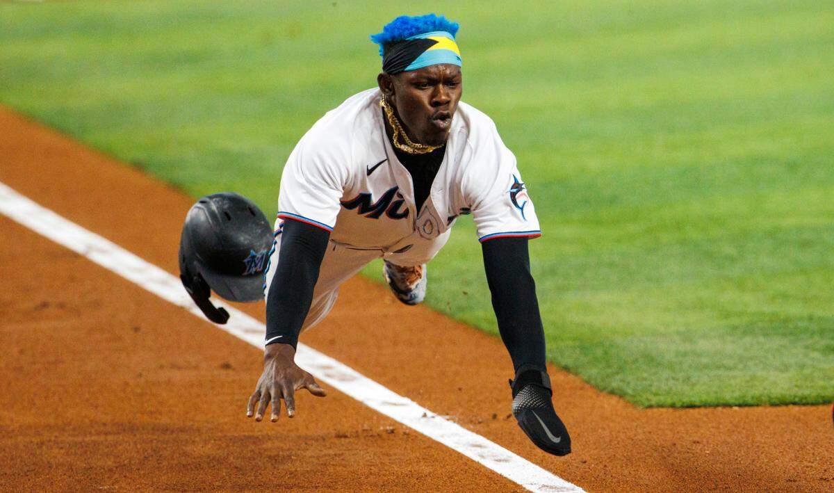 Miami Marlins second baseman Jazz Chisholm Jr. (2) scores during the first inning of a baseball game against the Washington Nationals at LoanDepot Park on Wednesday, May 18, 2022 in Miami, Florida..