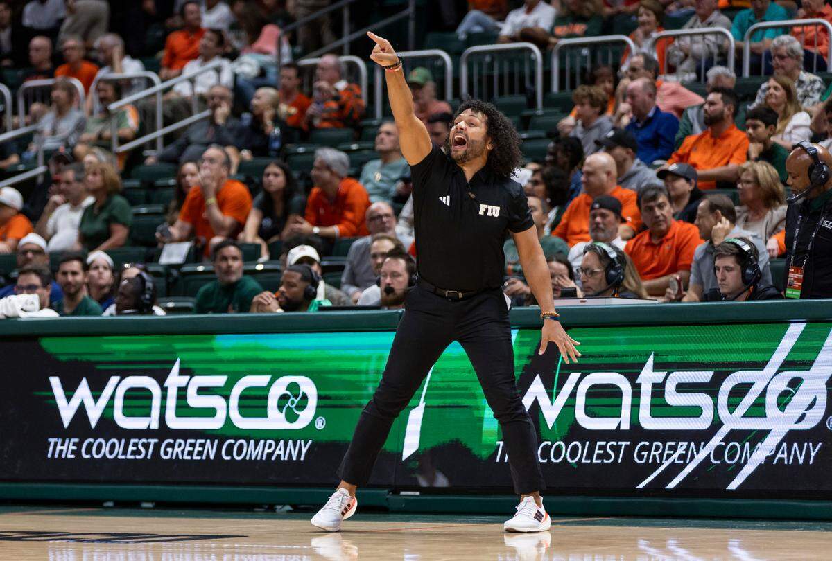 Florida International Golden Panthers head coach Jeremy Ballard reacts as his team plays against the Miami Hurricanes in the first half of an NCAA basketball game at the Watsco Center on Monday, Nov. 13, 2023, in Coral Gables, Fla.