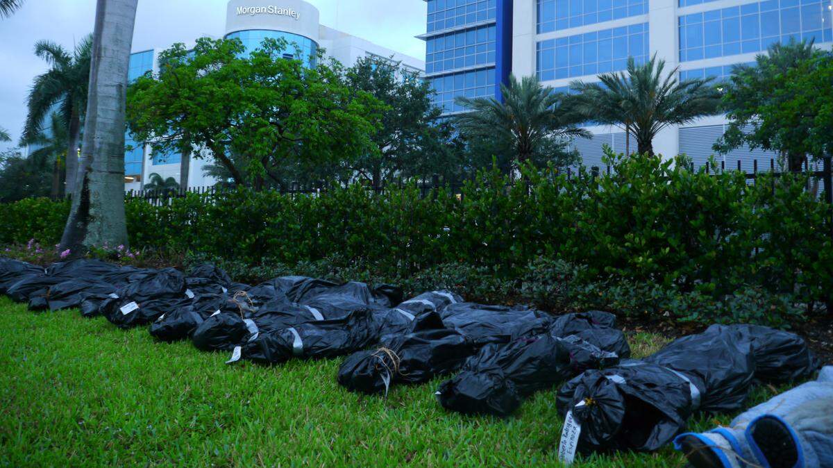 An unnamed activist collective placed 14 body bags with toe tags on the grounds of the GEO Group in Boca Raton, Florida, on May 15, 2020. The bags named people who died at immigration detention centers in South Florida.