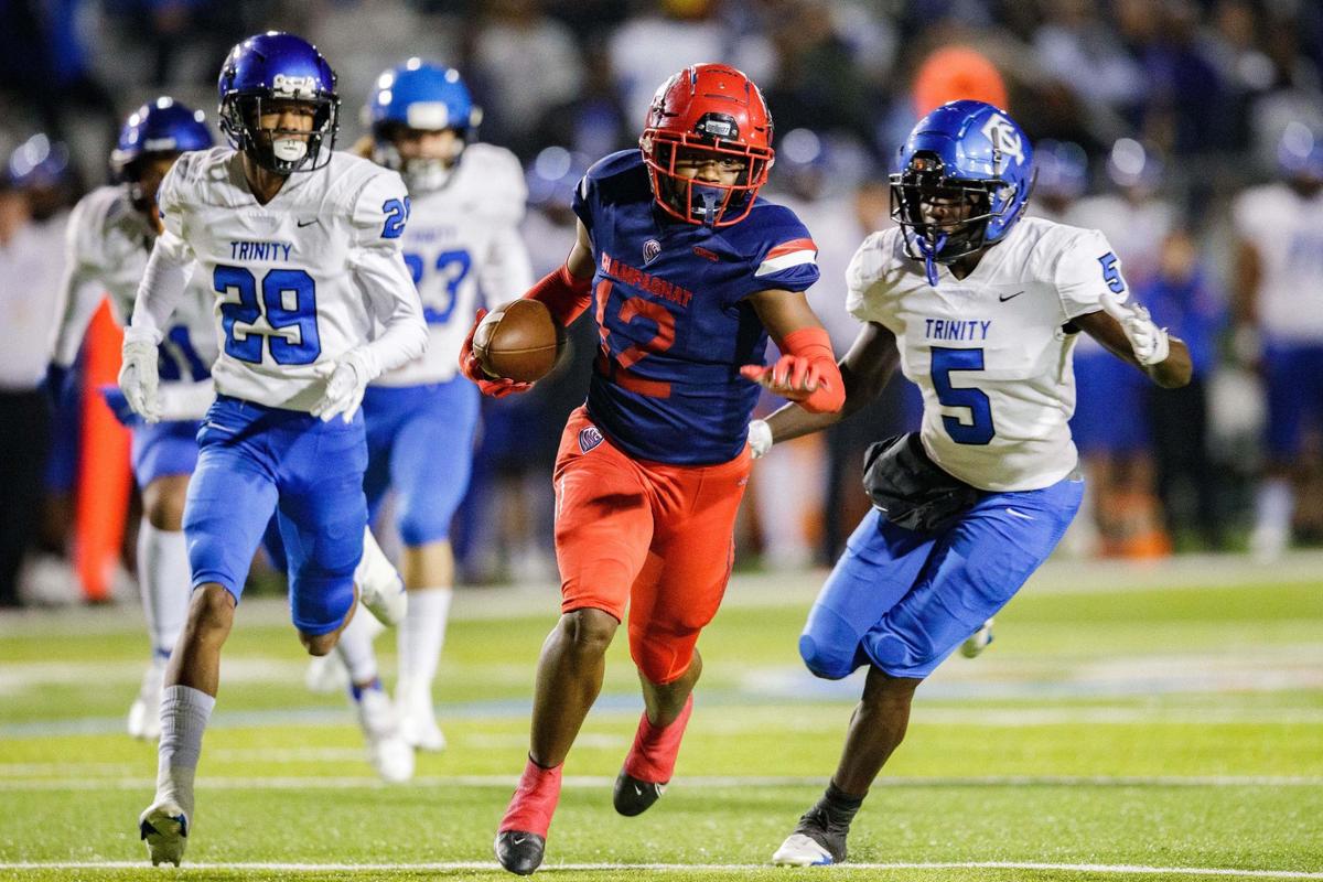 Champagnat’s Kevin Blount (12) makes his way towards the end zone for a touchdown. Trinity Christian leads Champagnat 14-7 at the half of the Class 2A State Championship game at Gene Cox on Thursday, Dec. 9, 2021.