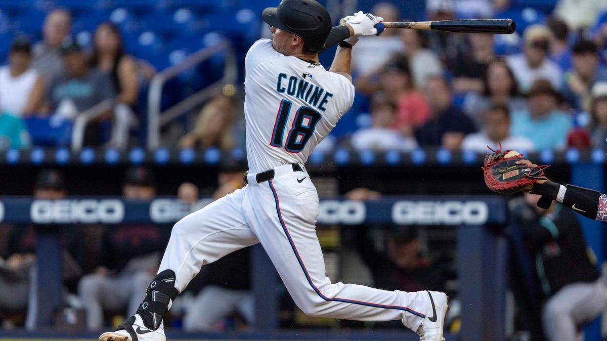 Miami Marlins outfielder Griffin Conine (18) swings at a pitch during the second inning of an MLB game against the Arizona Diamondbacks at loanDepot park on Wednesday, April 16, 2025, in Miami, Fla.