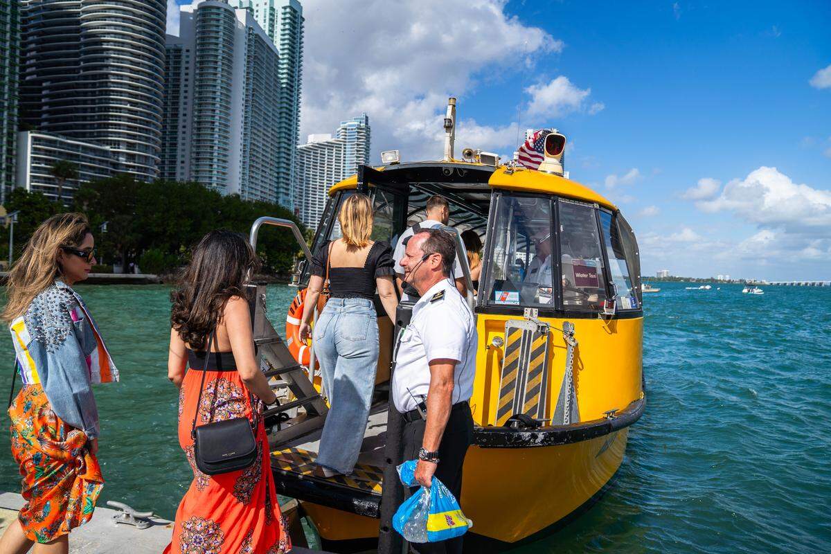 Passengers board a complimentary water taxi during Miami Art Week.