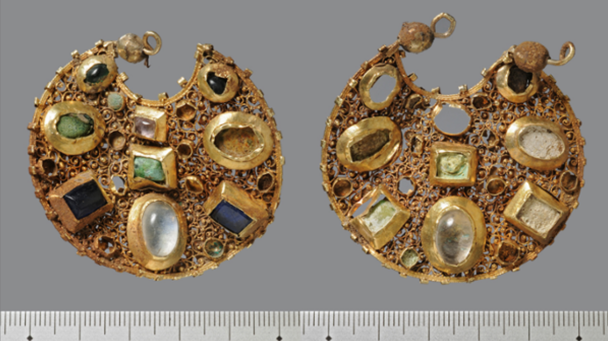 The gold earrings found buried.