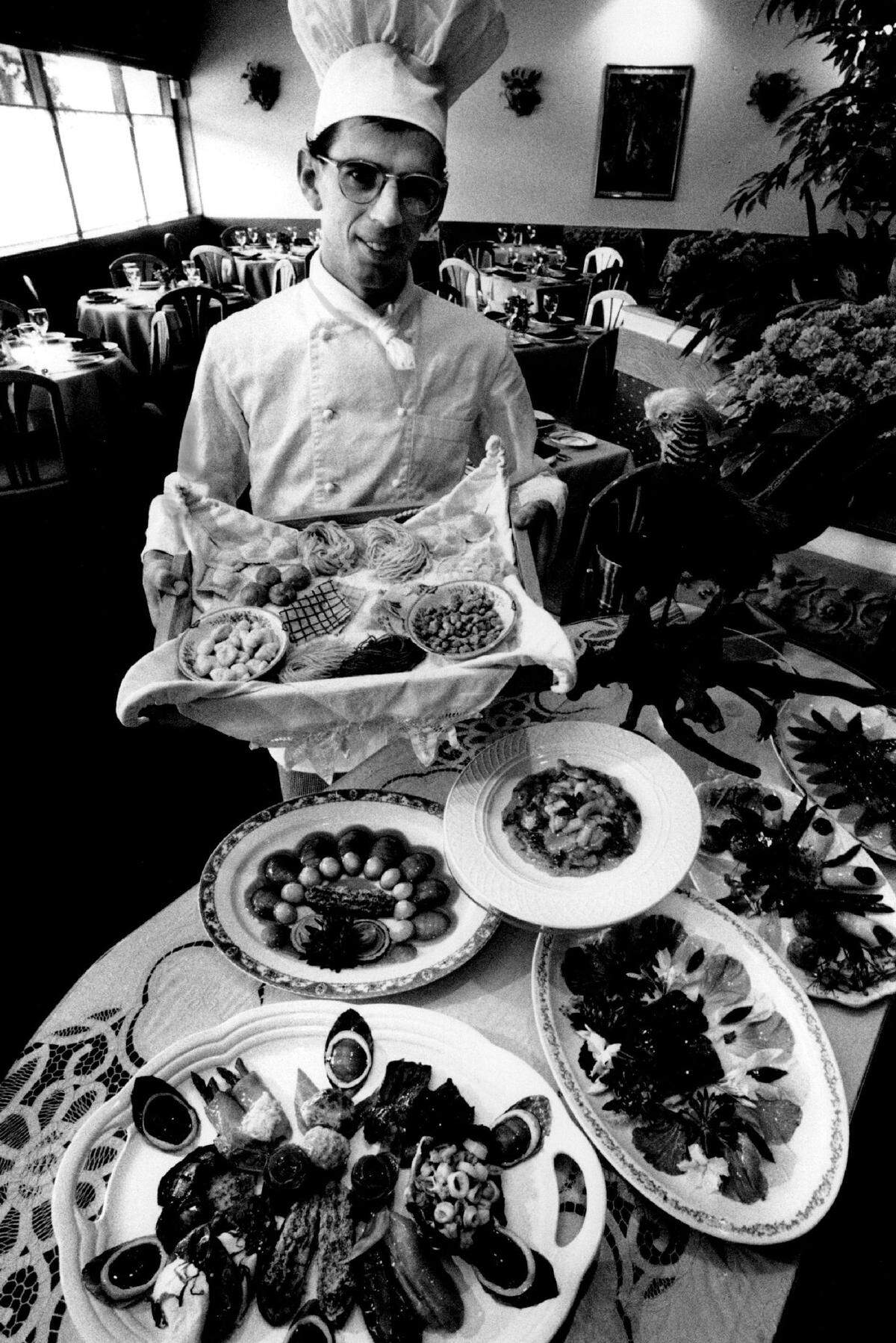 Primavera Restaurant Chef Ciacomo Dresseno stands before a buffet table in Fort Lauderdale in 1992.