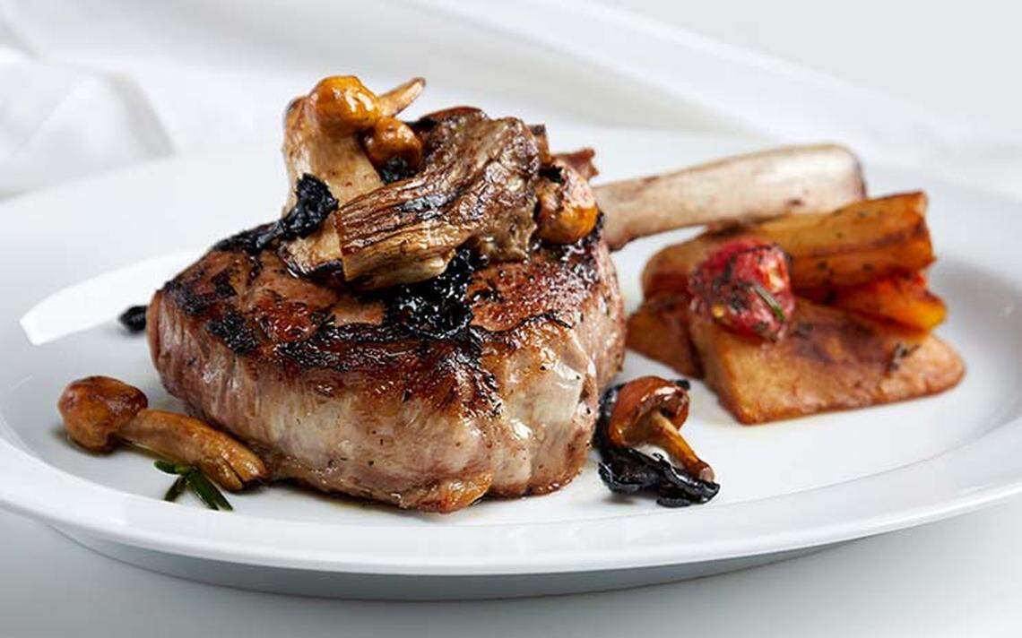 The veal chop comes with a marsala reduction and grilled vegetables.