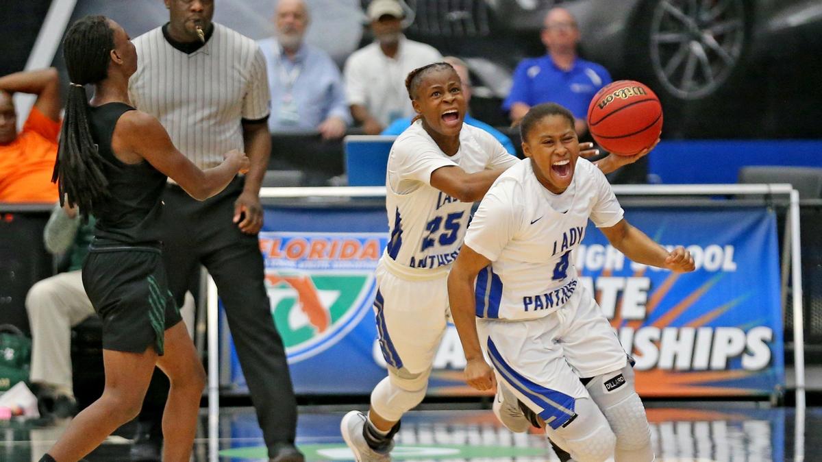 Dillard HS Genovea Johnson (25) and Briah Christia screams as the clock expires to give Panthers twirl 10th 7A Finals Girl’s State Basketball Championships as they defeat Nease HS at the RP Funding Center in Lakeland, Florida, Saturday, March, 2, 2019.