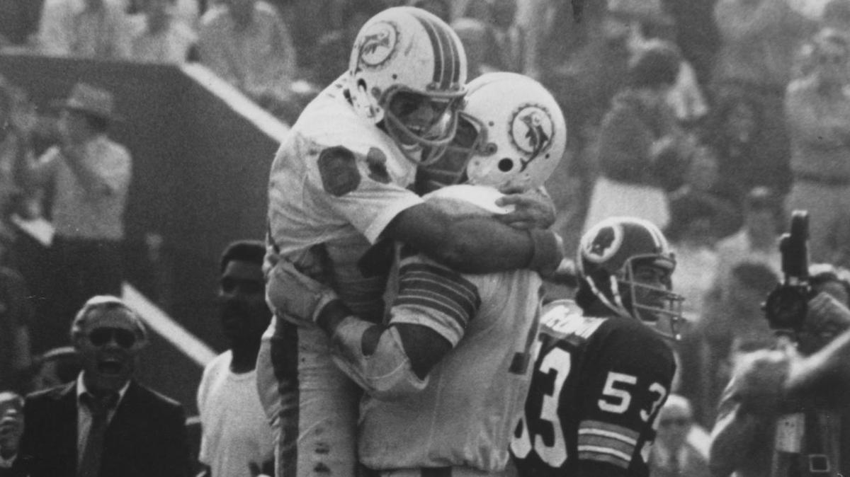 Miami Dolphins Howard Twilley (81) and Norm Evans, rejoice in the team’s Super Bowl victory over the Redskins in 1973. Miami Herald File Photo.