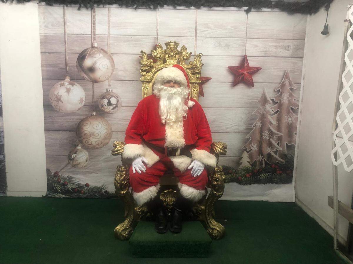 Santa at Santa’s Enchanted Forest is giving Mall Santa, but we don’t mind.