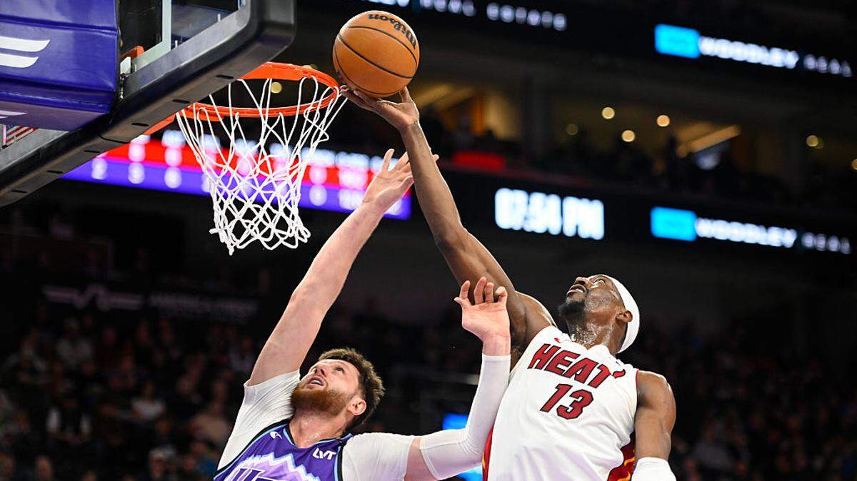 Bam Adebayo #13 of the Miami Heat rebounds over Jusuf Nurkic #30 of the Utah Jazz during the first half of the game at Delta Center on January 24, 2026 in Salt Lake City.
