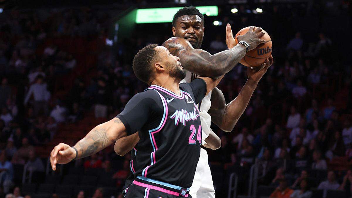 Zion Williamson #1 of the New Orleans Pelicans rebounds the ball against Norman Powell #24 of the Miami Heat during the first quarter at Kaseya Center on January 04, 2026 in Miami.