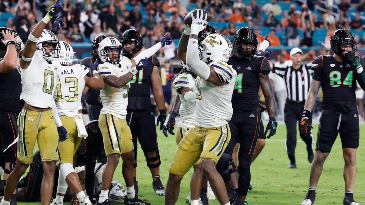 Georgia Tech Yellow Jackets defensive lineman Kyle Kennard (9) recovers the fumble by Miami Hurricanes running back Donald Chaney Jr. (2) late in the fourth quarter at Hard Rock Stadium in Miami Gardens on Saturday, October 7, 2023.