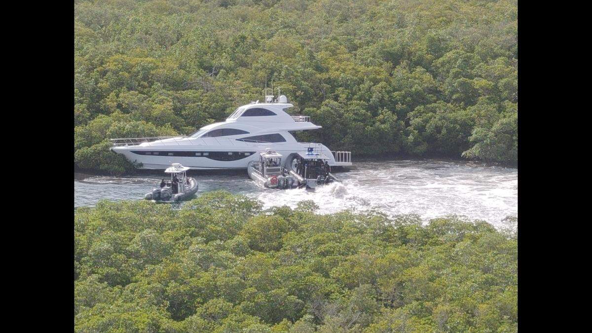 Video released by the sheriff’s office shows multiple patrol boats with armed deputies surrounded the yacht and brought it to a stop.