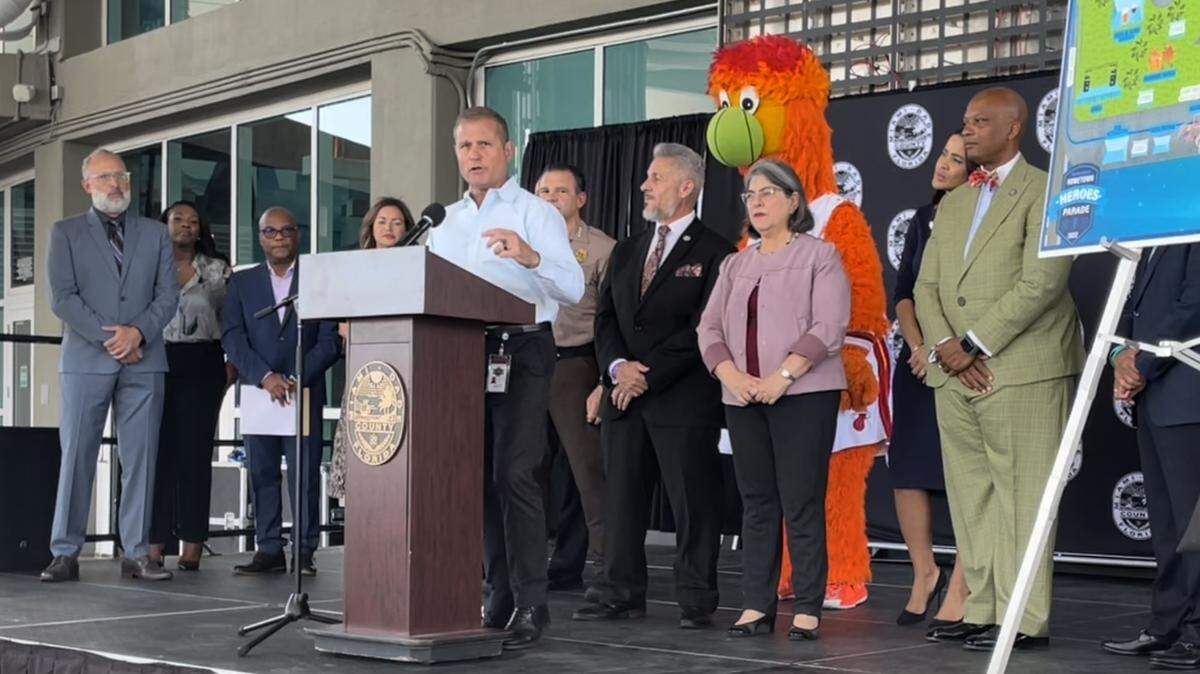 Pete Gomez, Miami-Dade County’s emergency management director, speaks about Tropical Depression Nine at a press conference at the FTX Arena on Sept. 23, 2022. To his left are Jose “Pepe” Diaz, chairman of the County Commission, Miami-Dade Mayor Daniella Levine Cava, and Oliver Gilbert, the commission’s vice chairman. Behind them is Burnie, mascot for the Miami Heat. The event was held to promote an Oct. 30 county “Hometown Heroes” parade celebrating police, firefighters, paramedics and healthcare workers.