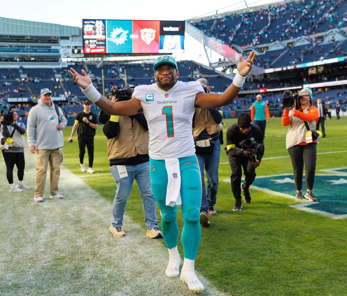 Miami Dolphins quarterback Tua Tagovailoa (1) greets the fans after their 35-32 win over the Chicago Bears during first quarter of an NFL football game at Soldier Field on Sunday, November 6, 2022 in Chicago, Illinois.