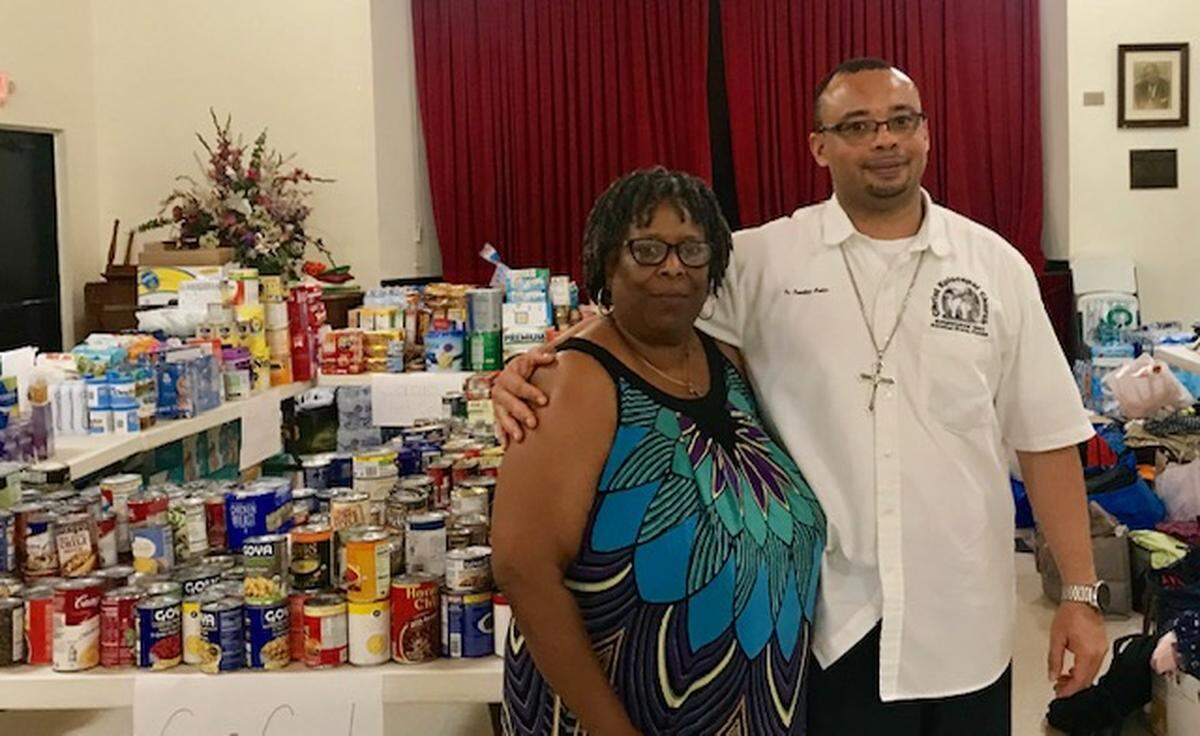 Jonathan Archer, right, rector of Christ Episcopal Church in Coconut Grove, and church member Alice Eason are among the volunteers collecting relief supplies for Hurricane Dorian victims in the Bahamas.
