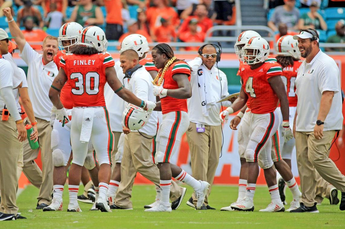 UM defensive back Malek Young (12) wears the turnover chain after Young intercepts the ball during game against Bethune-Cookman at Hard Rock Stadium on Saturday, September 2, 2017. Young is the first recipient of the turnover chain.