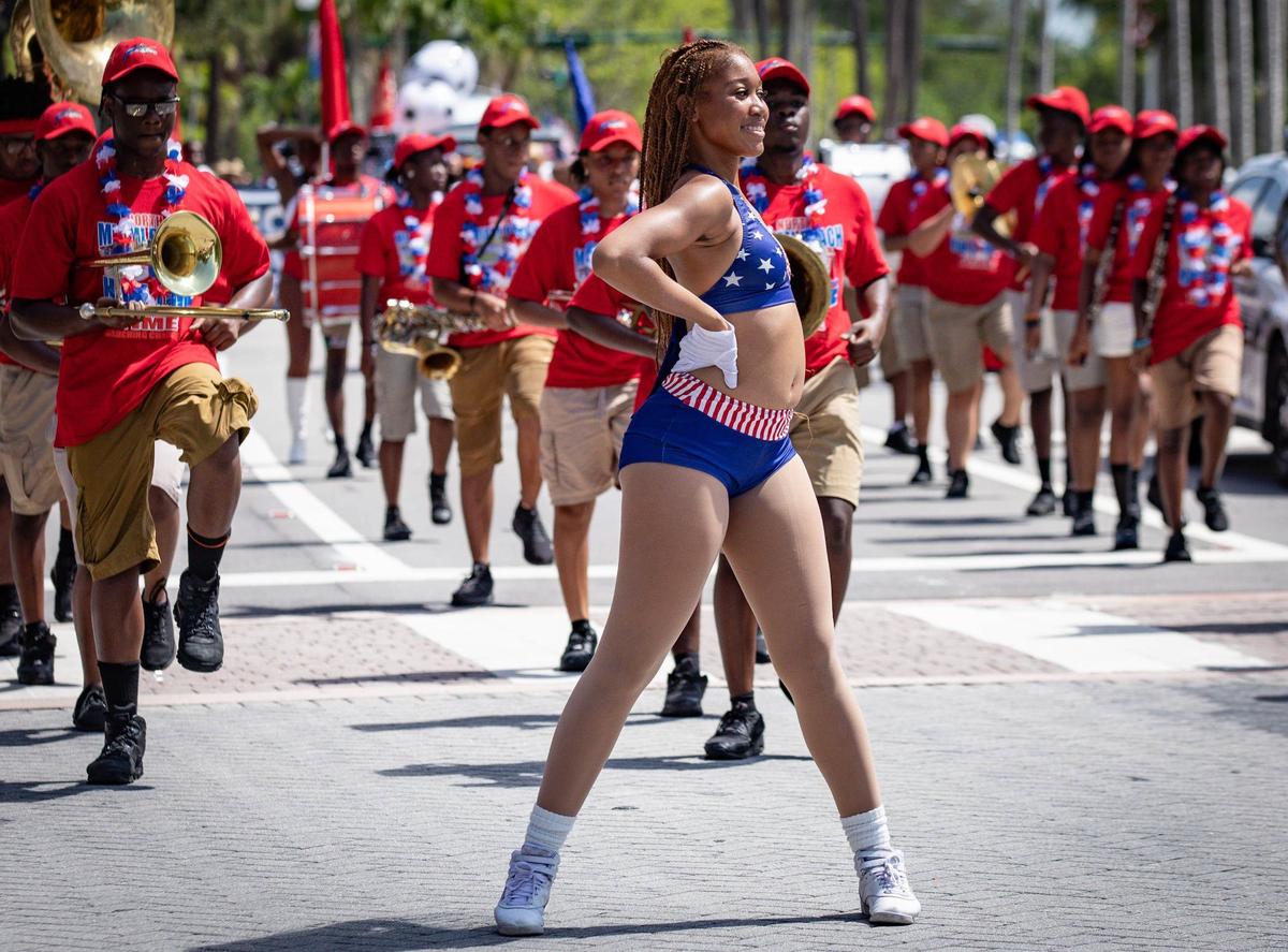 A parade participant from North Miami Beach High School performs at the Key Biscayne July Fourth parade on Thursday, July 4, 2024 on Crandon Blvd & Harbor Dr.