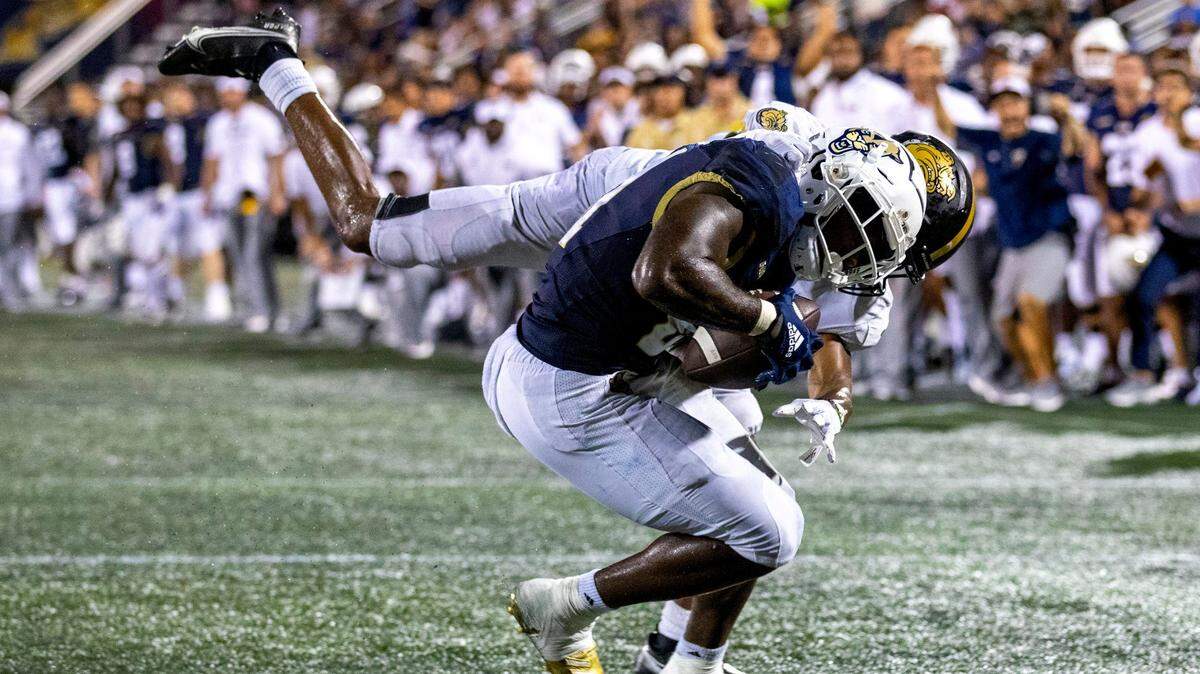 Florida International University running back EJ Wilson Jr. (21) cacthes the ball for a two-point conversion during the overtime of an NCAA Conference USA football game against Bryant University at Riccardo Silva Stadium in Miami, Florida, on Thursday, September 1, 2022.