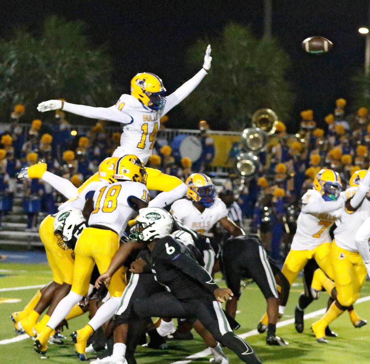 Northwestern Bulls attempt to block a field goal during Region 4-2M semifinal playoff football game against Miami Central Rockets on Friday, November 18, 2022 at Traz Powell Stadium in Miami. Andrew Uloza / for Miami Herald