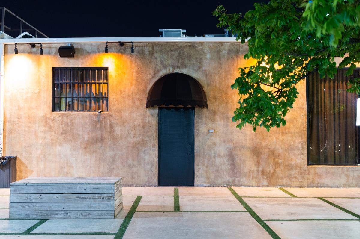 Open the black door to enter Dante’s HiFi in Wynwood.