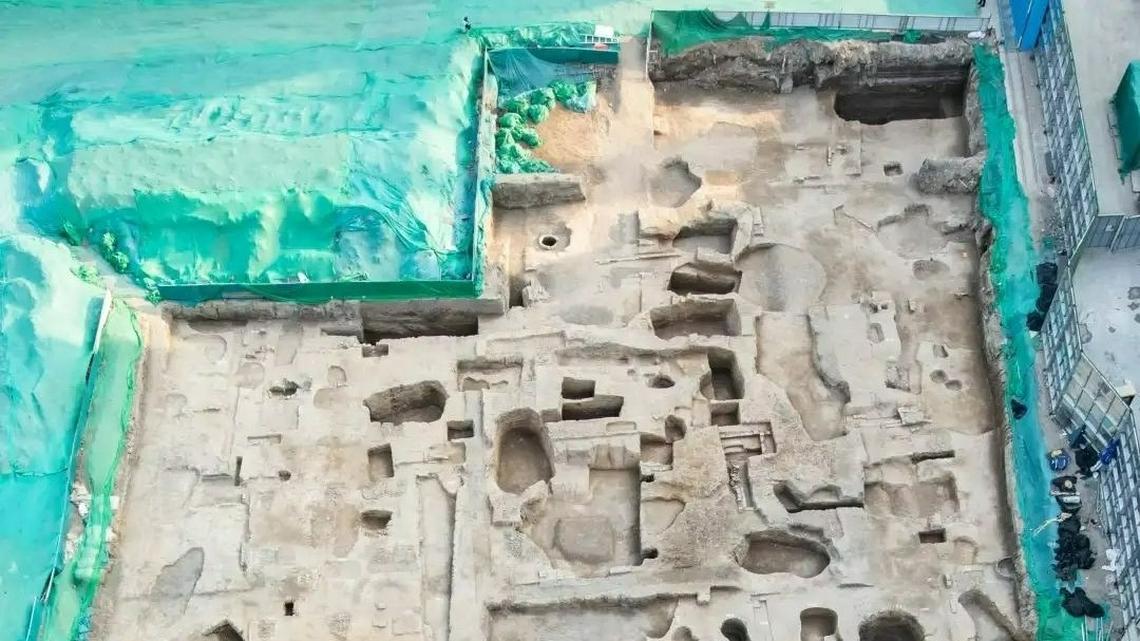 Archaeologists in China found the ruins of a building complex with jade books, statues and other artifacts near a dried river, photos show.