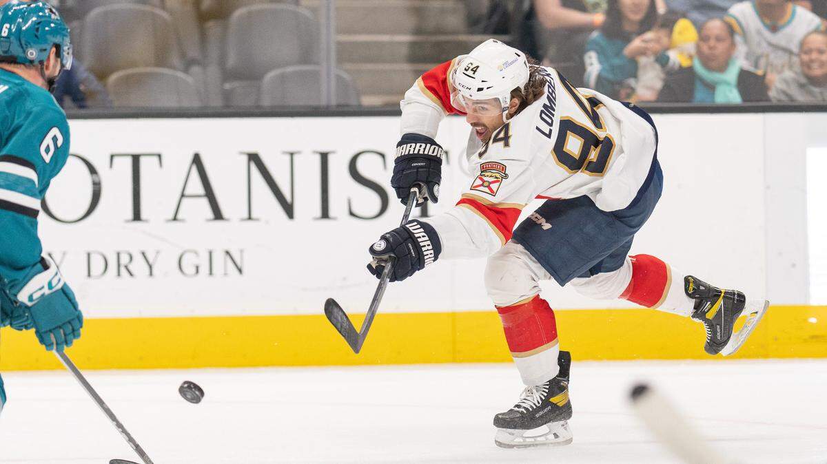 Nov 14, 2023; San Jose, California, USA; Florida Panthers left wing Ryan Lomberg (94) shoots the puck and scores during the first period against the San Jose Sharks at SAP Center at San Jose.