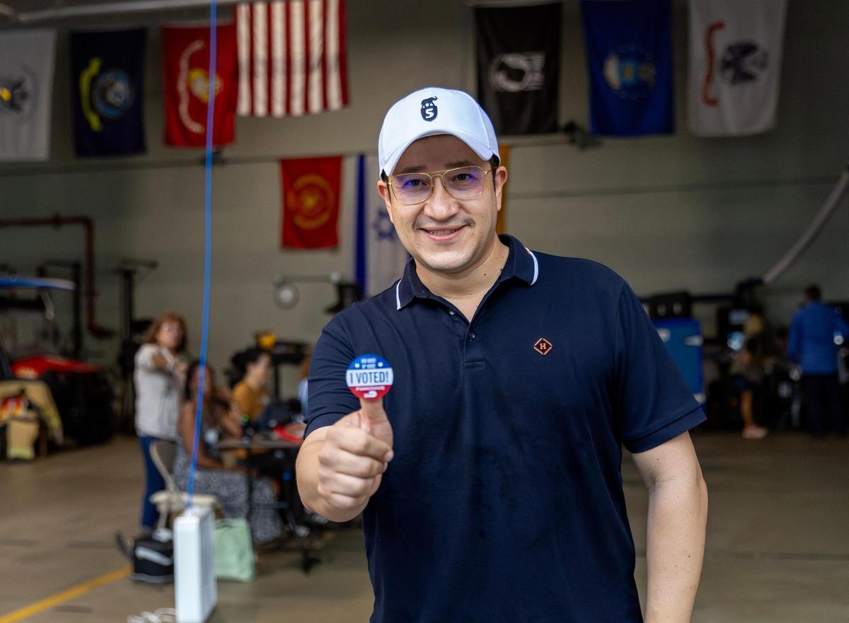 Miami Beach resident Jr. Lilchin poses with a “I Voted!” sticker after be voted at the Miami Beach Fire Station #4 on Tuesday, Nov. 5, 2024, in Miami Beach, Fla.