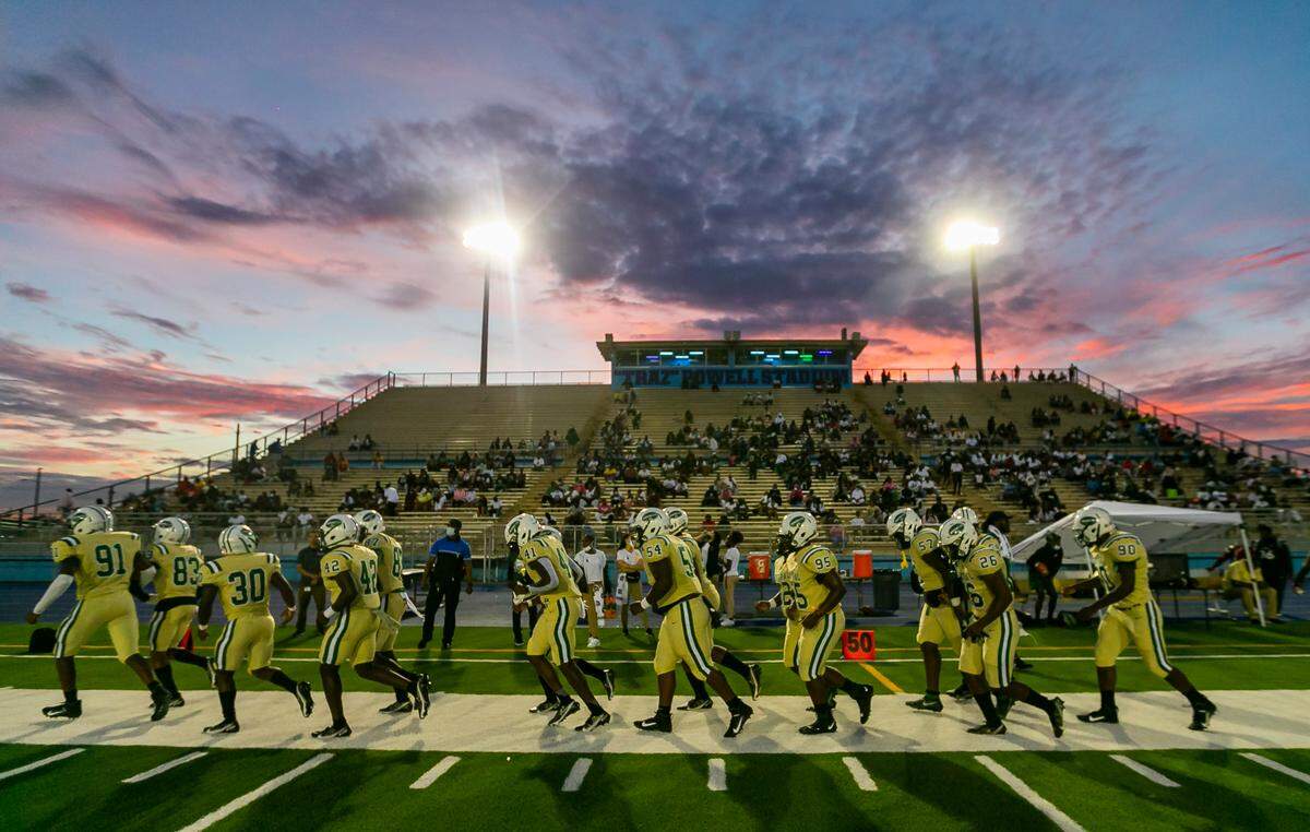 Miami Central Rockets warm up before the start of their football game against the Northwestern Bulls on Friday, October 1, 2021 at Nathaniel Traz Powell Stadium in Miami, Florida.